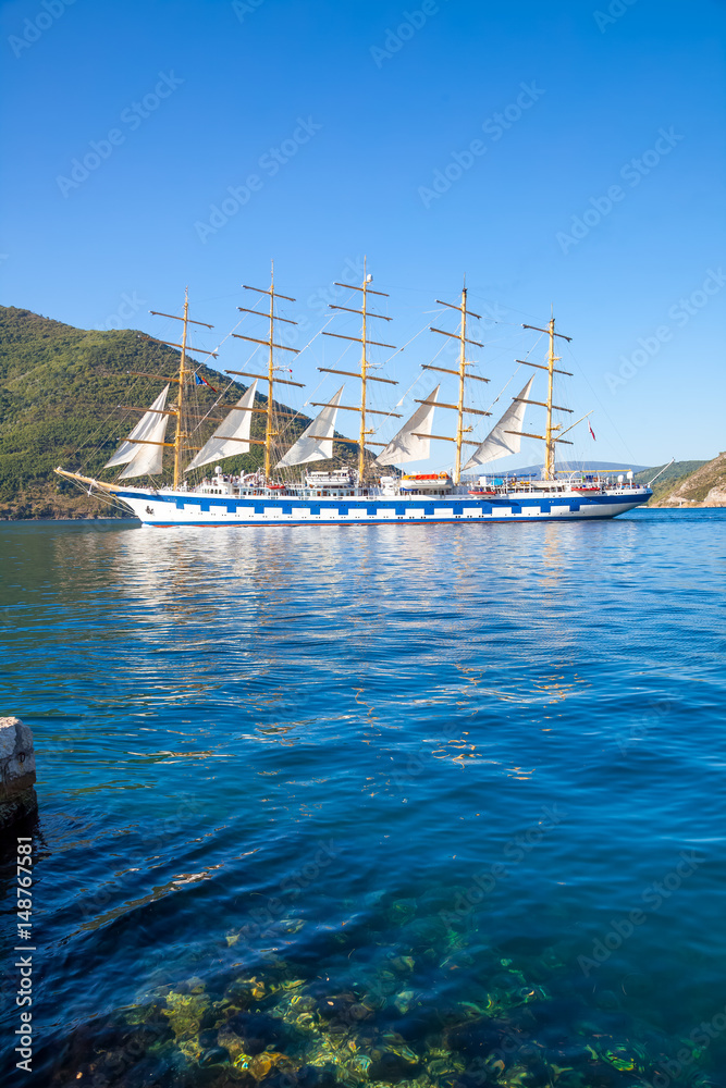 Obraz premium Beautiful sunny day in Perast, Montenegro, big sailing ship in the Kotor bay (Boka Kotorska), Montenegro, Europe.
