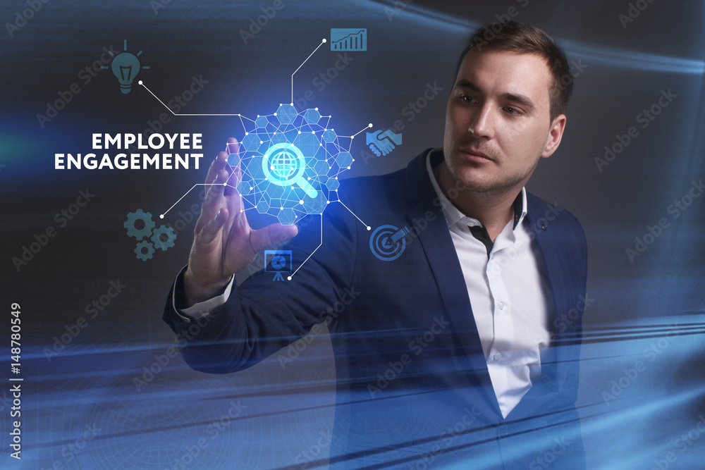 Business, Technology, Internet and network concept. Young businessman working on a virtual screen of the future and sees the inscription: Employee engagement Business, Technology, Internet and network concept. Young businessman working on a virtual screen of the future and sees the inscription: Employee engagement