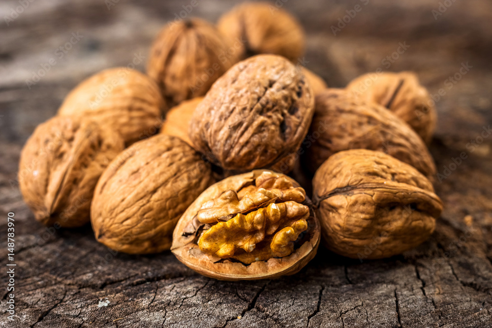 Walnuts on wooden table Walnuts on wooden table