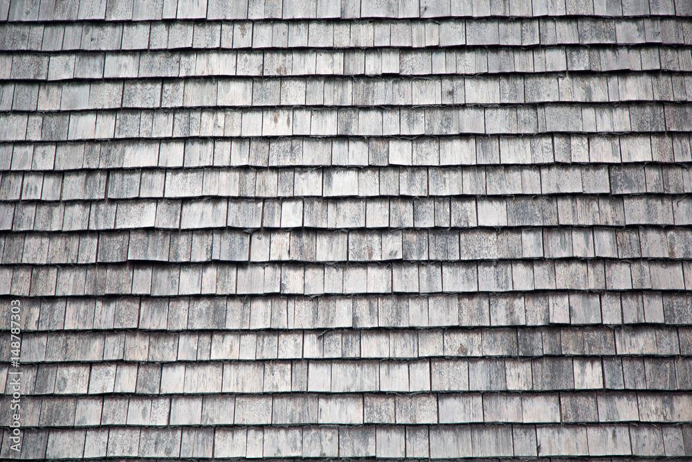 Traditional wooden shingles wall of an Austrian house. Traditional wooden shingles wall of an Austrian house.