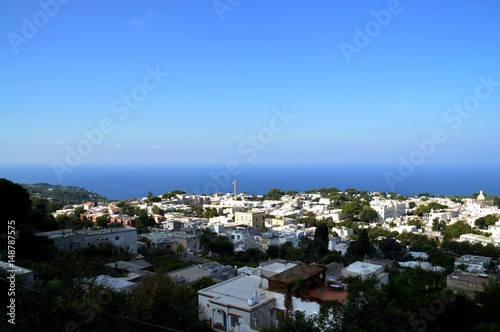white houses with deep blue mediteranean sea in background