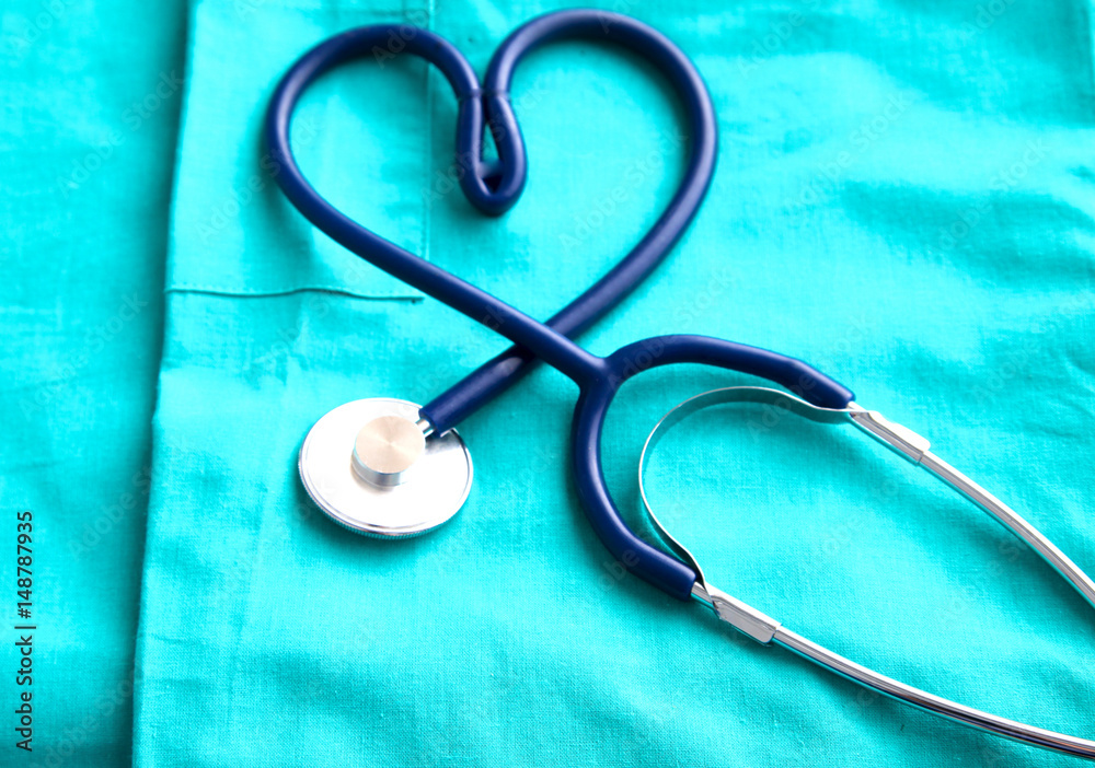 Stethoscope on a background of medical coat Stethoscope on a background of medical coat