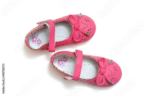 Beautiful pink baby shoes on a white background