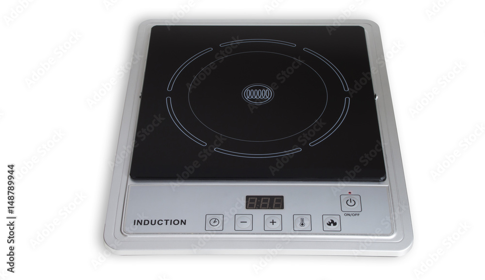 Portable induction cooker. Induction cooktop on white background. Portable induction cooker. Induction cooktop on white background.