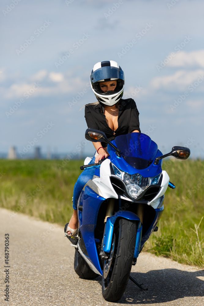 Portrait of a beautiful woman and a motorcycle of speed