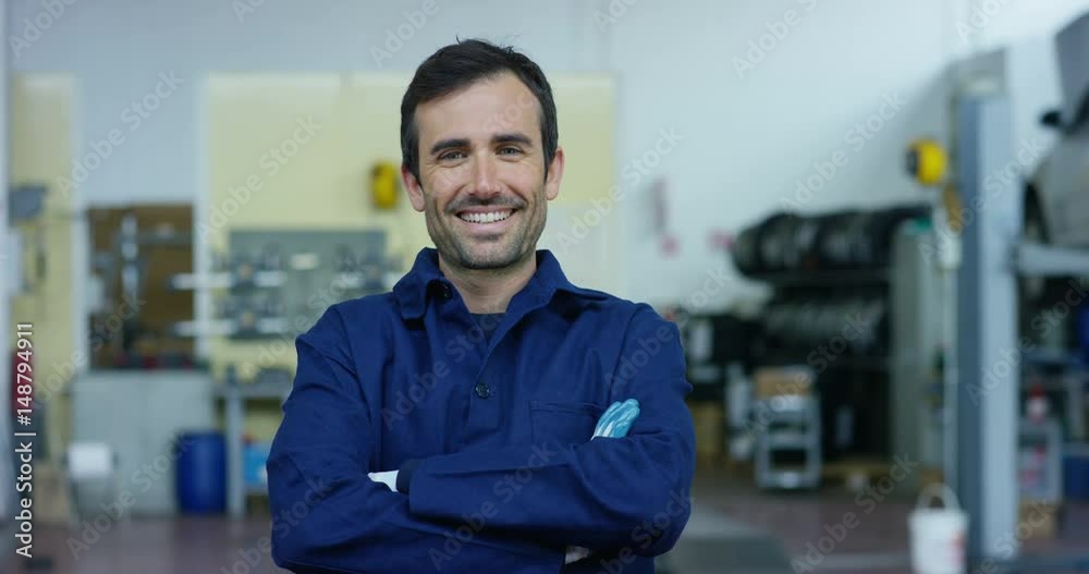Portrait of a young beautiful car mechanic in a car workshop, in the background of a car service Concept repair of machines, fault diagnosis, repair specialist, technical maintenance on-board computer