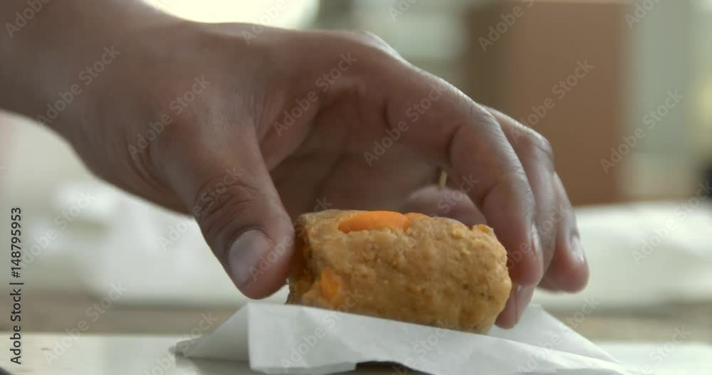 black chefs hand puts a pastry ball of dough front camera black chefs hand puts a pastry ball of dough front camera