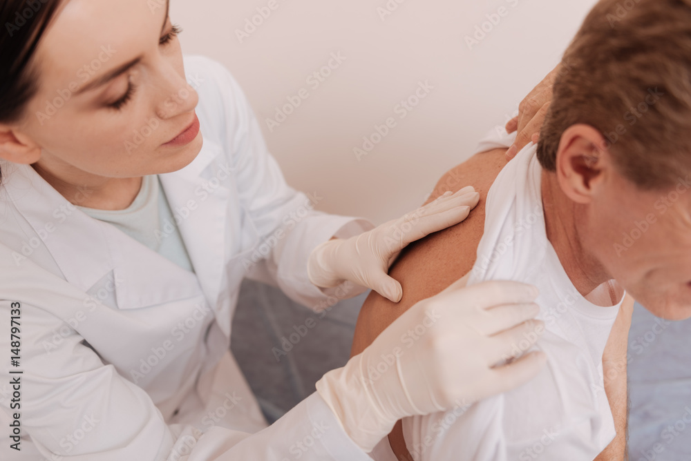 Obraz premium Trained mindful rheumatologist checking different section of spine