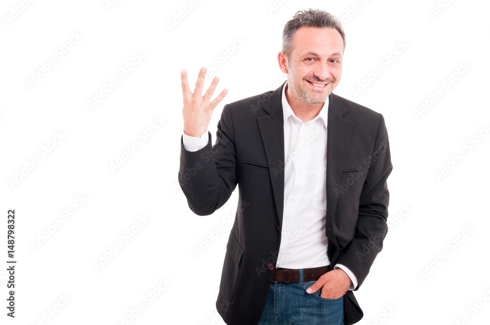 Cheerful businessman showing four fingers Cheerful businessman showing four fingers