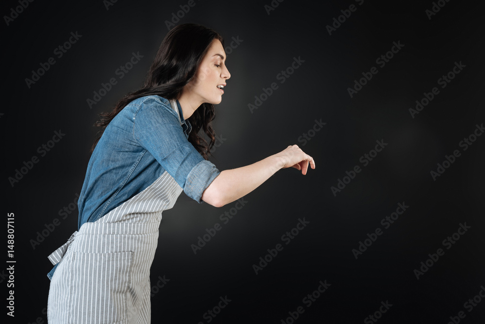 Very attentive brunette checking her dish Very attentive brunette checking her dish