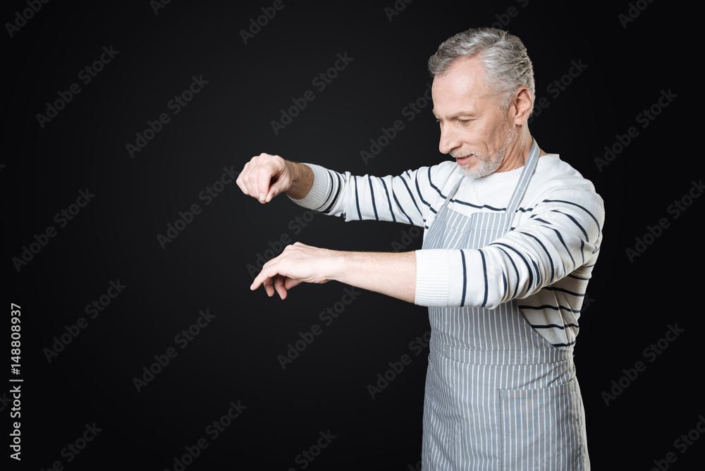 Enigmatical retiree while preparing dinner