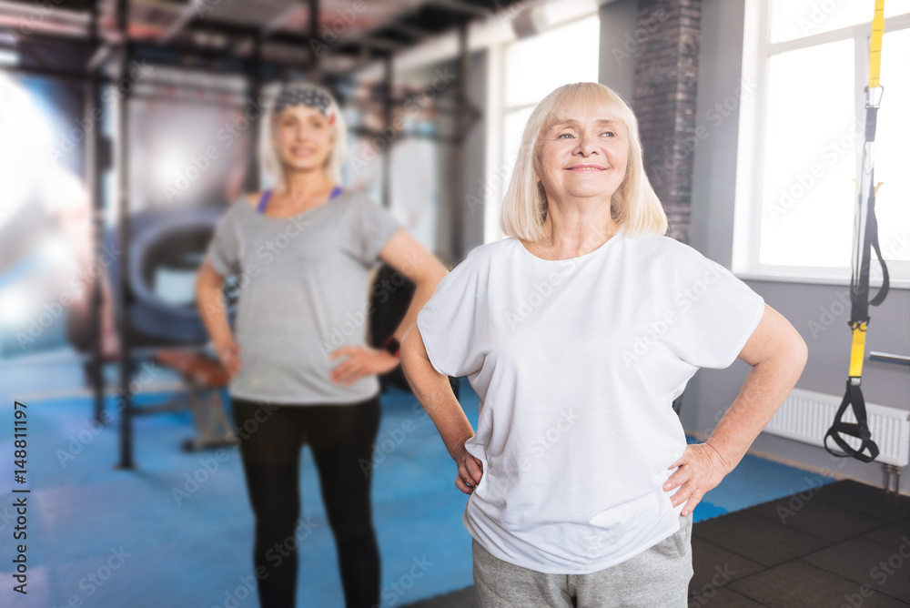 Fototapeta premium Happy elderly woman exercising