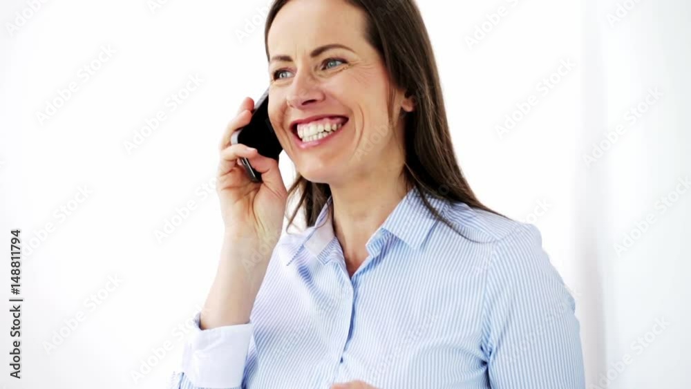 businesswoman calling on smartphone at office businesswoman calling on smartphone at office