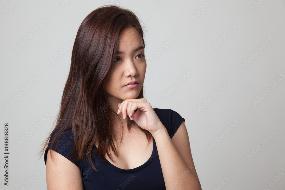 Serious young Asian woman look away. Serious young Asian woman look away.