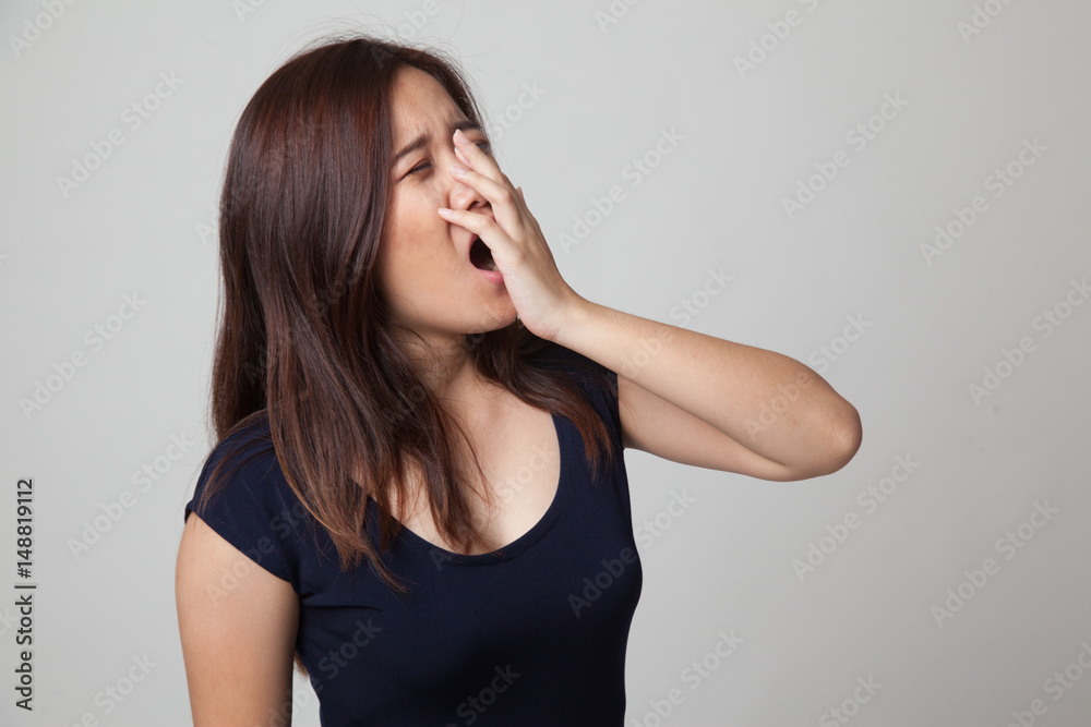 Sleepy young Asian woman yawn. Sleepy young Asian woman yawn.