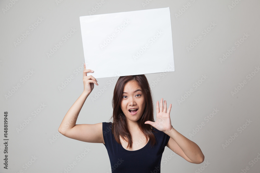 Young Asian woman surprise with white blank sign. Young Asian woman surprise with white blank sign.
