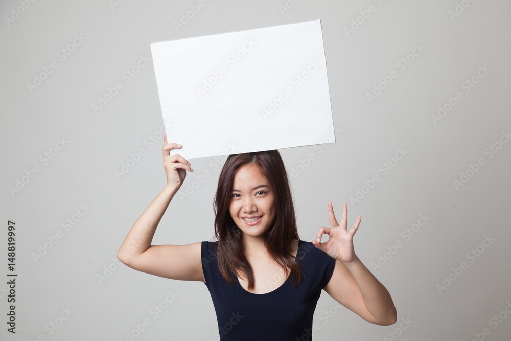 Young Asian woman show OK with white blank sign. Young Asian woman show OK with white blank sign.