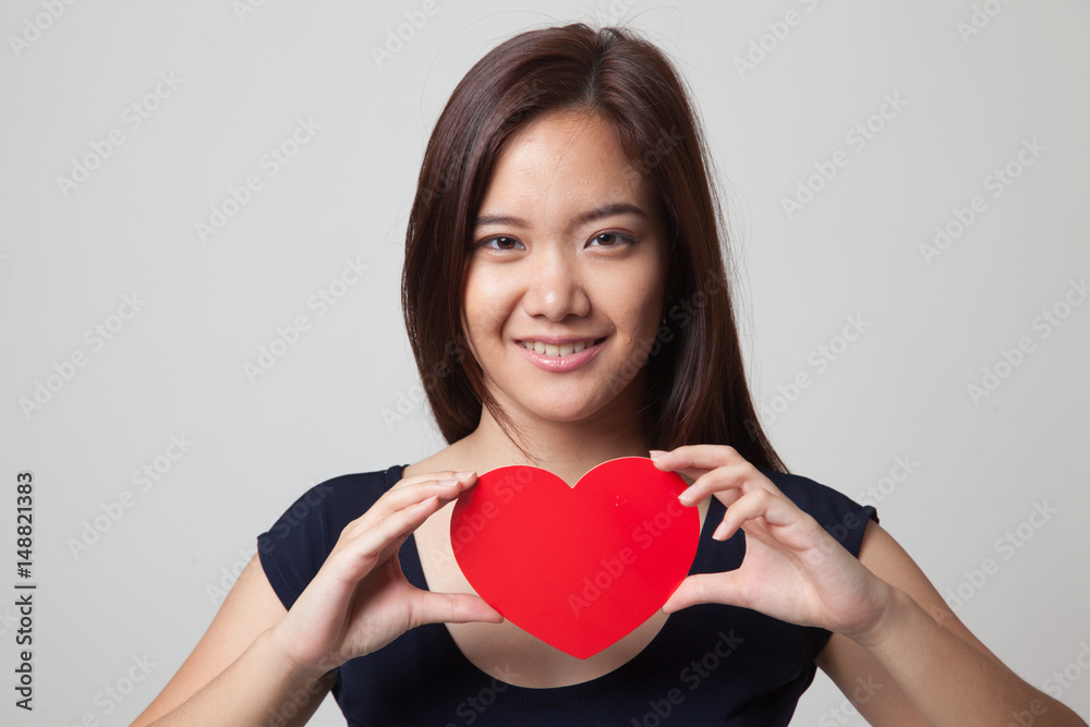 Asian woman with red heart. Asian woman with red heart.