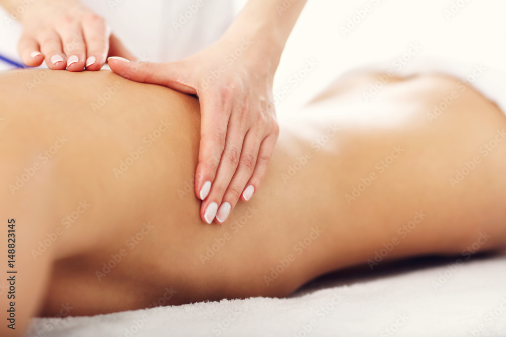 Beautiful woman getting massage in spa