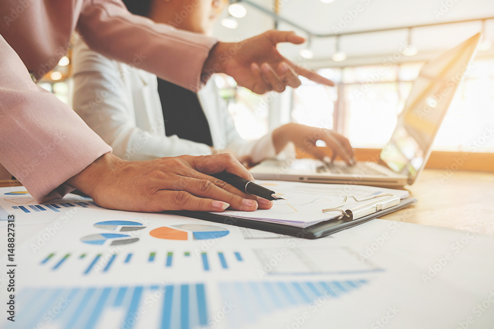Business concept. Business people discussing the charts and graphs showing the results of their successful teamwork. Business concept. Business people discussing the charts and graphs showing the results of their successful teamwork.