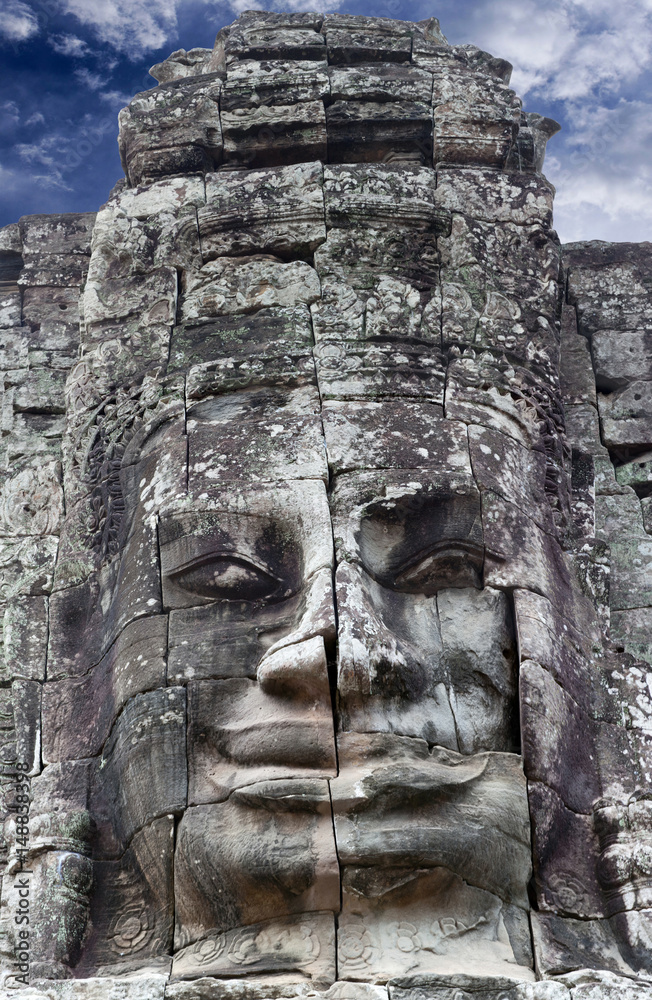 Giant stone face of Prasat Bayon temple in Angkor Thom, Cambodia