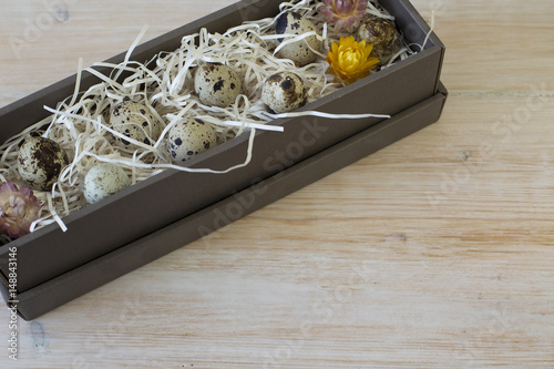 Quail eggs in box photo