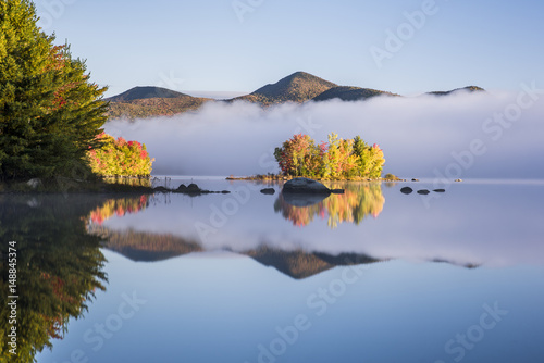 Chittenden Pond and Green Mountains - Island with Autumn / Fall Tree Colors in Fog with Reflection - Vermont photo