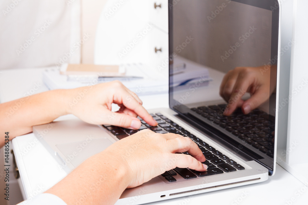 close up of someone hands taping on modern laptop keyboard close up of someone hands taping on modern laptop keyboard