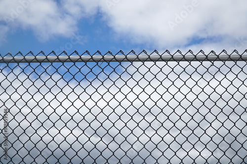 iron chain link fence against sky © nd700