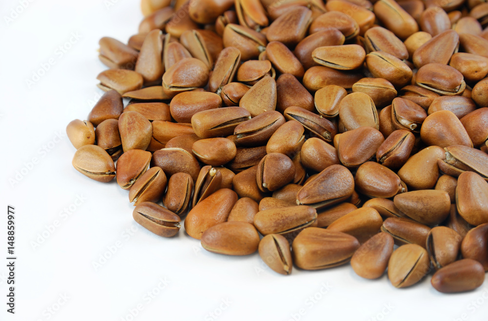 fresh pine nuts isolated on white background fresh pine nuts isolated on white background