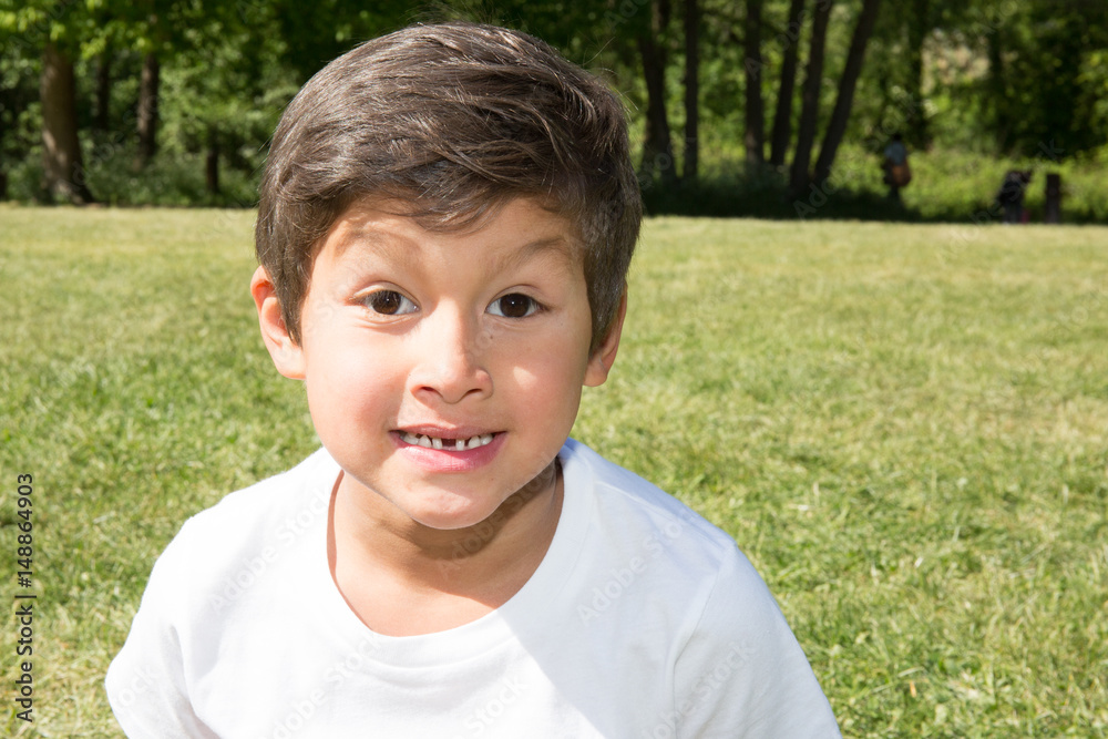 young boy in his garden in suumer day young boy in his garden in suumer day