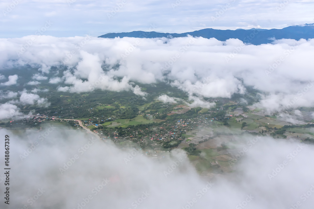 Aerial View of Village landscape and River over Clouds in Chiangdao Thailand
