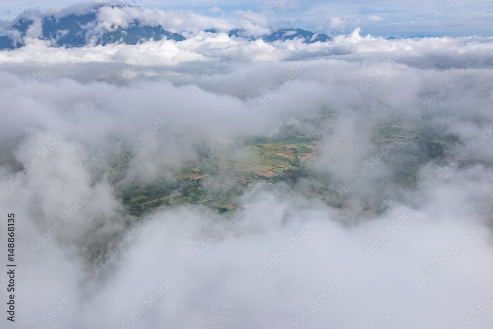 Aerial View of Village landscape and River over Clouds in Chiangdao Thailand
