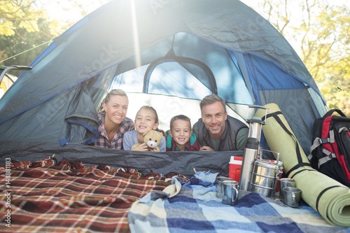 Smiling family lying in the tent © wavebreak3