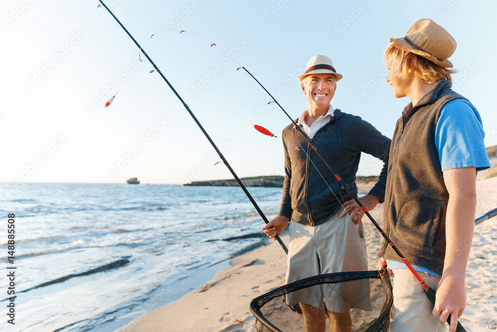 Senior man fishing with his grandson Senior man fishing with his grandson