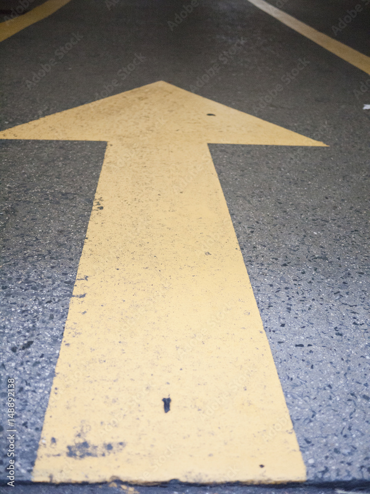 Fototapeta premium Painted yellow arrow.