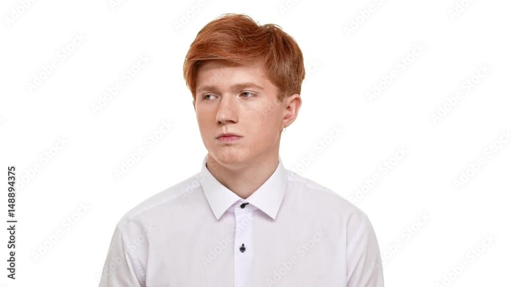 Dissapointed foxy handsome Caucasian young man heavily sighing from headache. Footage on white background in slowmotion Dissapointed foxy handsome Caucasian young man heavily sighing from headache. Footage on white background in slowmotion