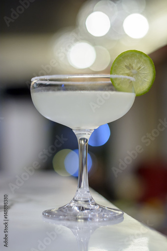 Margarita and lime on bokeh background