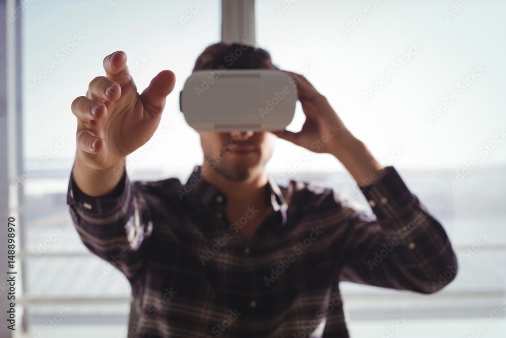 Businessman using virtual reality headset Businessman using virtual reality headset