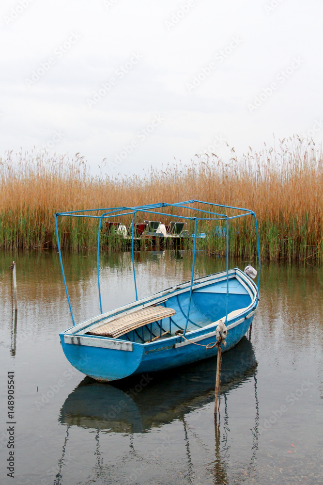 tourist and fisherman boats on lake ohrid in macedonia,