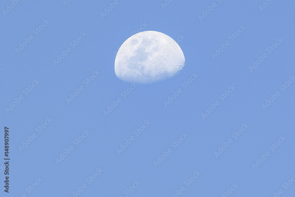 half moon during the day half moon during the day