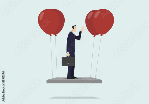 Self sabotage concept: businessman pushing needle to pop the balloon.