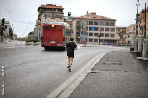 Morning jog along the street of old Rome. Italy © Anna Jurkovska