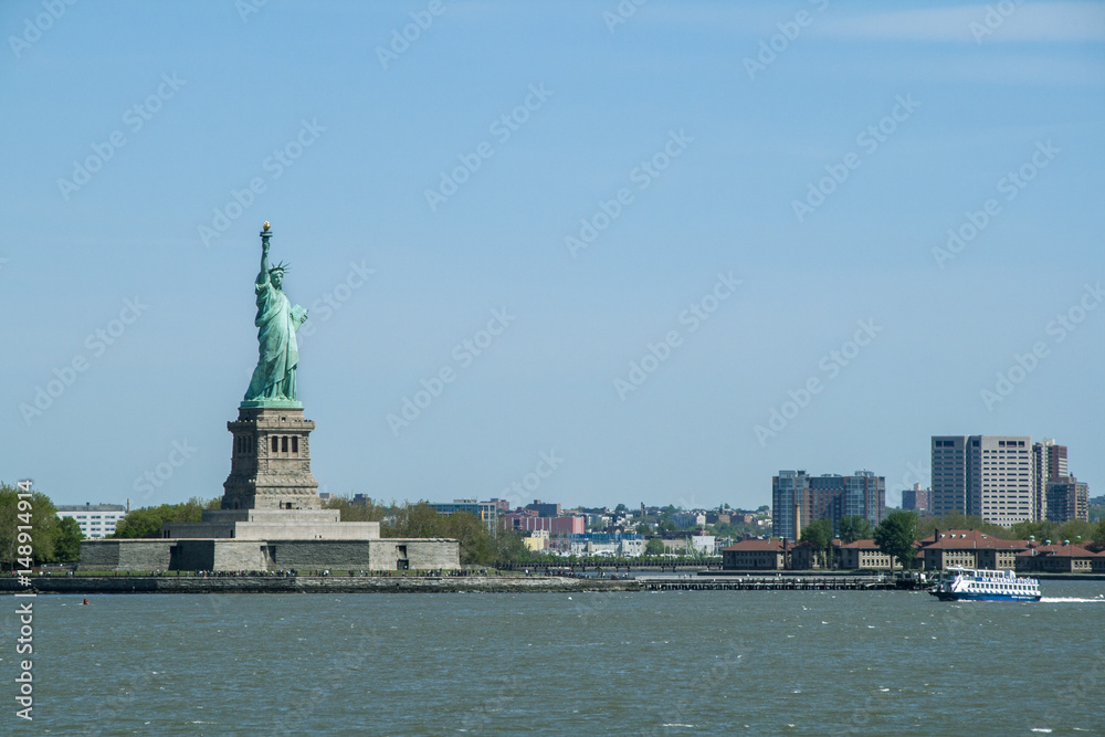 Statue of Liberty in New York with Manhattan view in the background Statue of Liberty in New York with Manhattan view in the background