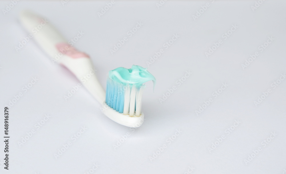 toothpaste put on toothbrush in white background toothpaste put on toothbrush in white background