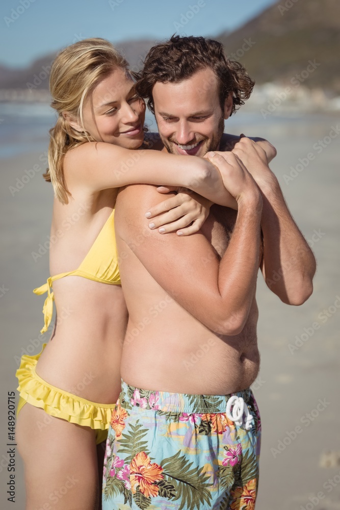 Happy couple embracing at beach Happy couple embracing at beach