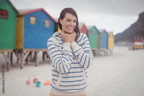 Smiling woman standing at beach photo