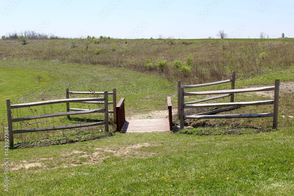 The bridge and the wooden fence of the park landscape. The bridge and the wooden fence of the park landscape.