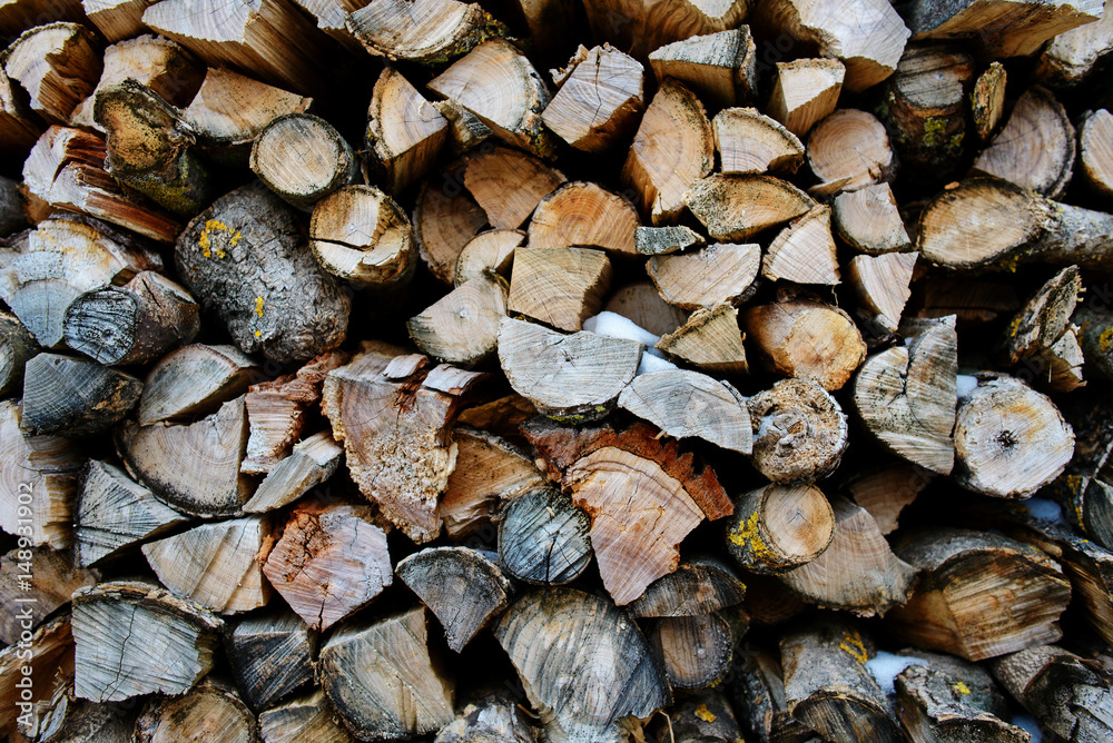 A stack of birch firewood - a natural background A stack of birch firewood - a natural background