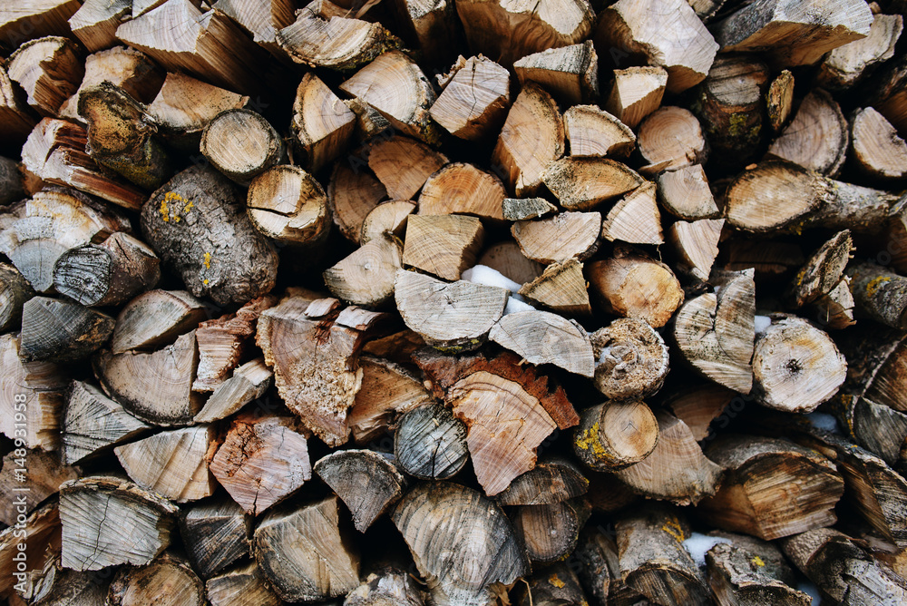 A stack of birch firewood - a natural background A stack of birch firewood - a natural background